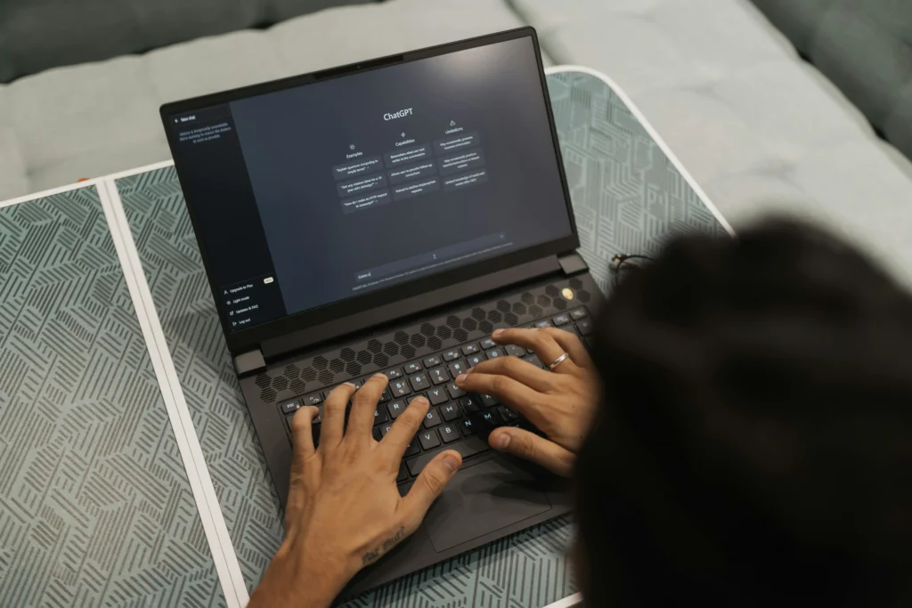 A man using an AI Chrome extension with ChatGPT open on his screen, enhancing browsing and productivity.
